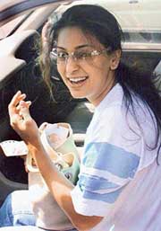 Bollywood actress Juhi Chawla is all smiles as she sits in a car in Chandigarh on Friday. She is in the city to shoot Des Hoya Pardes directed by Manoj Punj ... - ct6