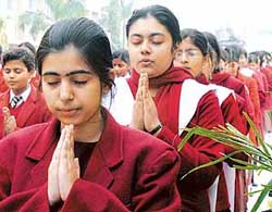 Students of DAV School, Patna, join their hands in prayer on Monday during a "yagna" and "havan" organised by them for the safe return of Kislay Kaushik, a student of DPS, Patna, who was kidnapped last week