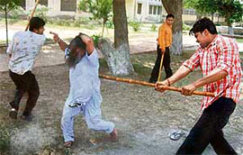 A man being beaten up by followers of Dera Sacha Sauda in Bathinda.