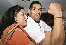 The Great Khali (Dalip Singh Rana), India-born wrestler, with his wife Harminder Kaur on his arrival at the Indira Gandhi International Airport in New Delhi on Friday night.