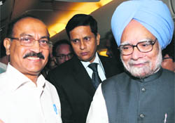 Prime Minister Manmohan Singh with The Tribune Editor-in-Chief Raj Chengappa on board - ind2