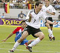 Germany's Oliver Neuville celebrates scoring