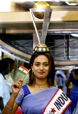 Fashion designer Rashmi Nair sports a replica of the World Cup on her head in Mumbai