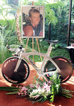 A portrait of Australian cyclist Amy Gillett hangs above her bike during her funeral service in Ballarats Doveton Park Chapel