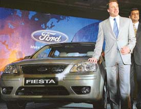 Ford Chairman and CEO William Clay Ford Jr poses with newly unveiled Ford Fiesta in New Delhi on Tuesday. 