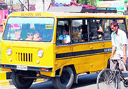 Ignoring safety norms, an overloaded auto and a school van ferry schoolchildren in Amritsar on Tuesday