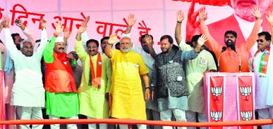 (From left) Pauri Garhwal parliamentarian Satpal Maharaj, ex-CM Dr Ramesh Pokhriyal Nishank, BJP prime ministerial candidate Narendra Modi, BJP state president Teerath Singh Rawat at Litho Press Ground in Haridwar on Saturday.