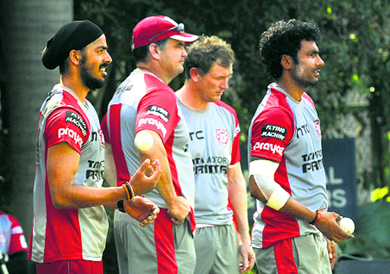 Kings XI bowlers during a practice session; and coach of Sunfoil Dolphins in Mohali on Tuesday.